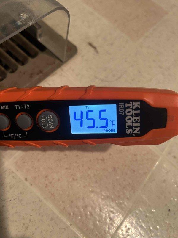 Performed routine cooling system maintenance check, verifying temperature differentials with Klein Tools IR07 thermometer. Readings showed 21.2°C supply temperature and 45.5°C at system probe point, confirming proper operation within manufacturer specifications. Customer is obtaining replacement filters to be installed at unit location.