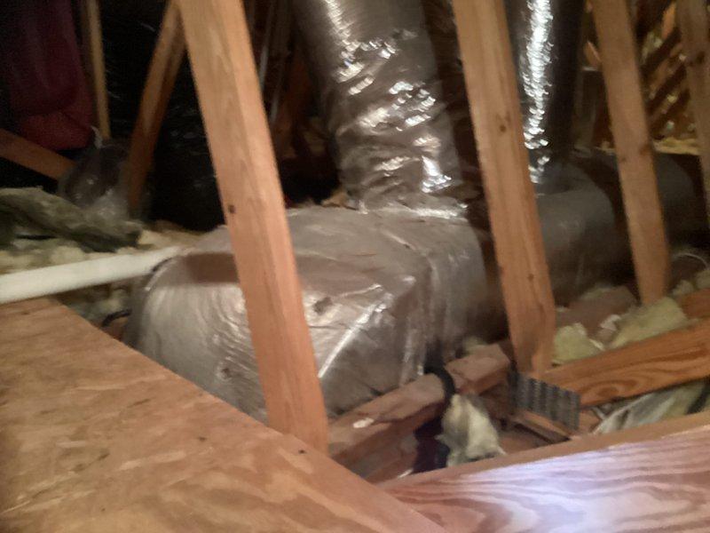 Conducted a geothermal system replacement estimate following referral. Inspected existing installation including ductwork in attic space with insulated components and evaluated current valve assembly/pump station configuration. Documented system conditions with photographs to develop comprehensive replacement proposal for the aging geothermal HVAC equipment.