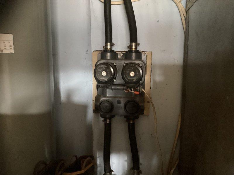 Conducted a geothermal system replacement estimate following referral. Inspected existing installation including ductwork in attic space with insulated components and evaluated current valve assembly/pump station configuration. Documented system conditions with photographs to develop comprehensive replacement proposal for the aging geothermal HVAC equipment.