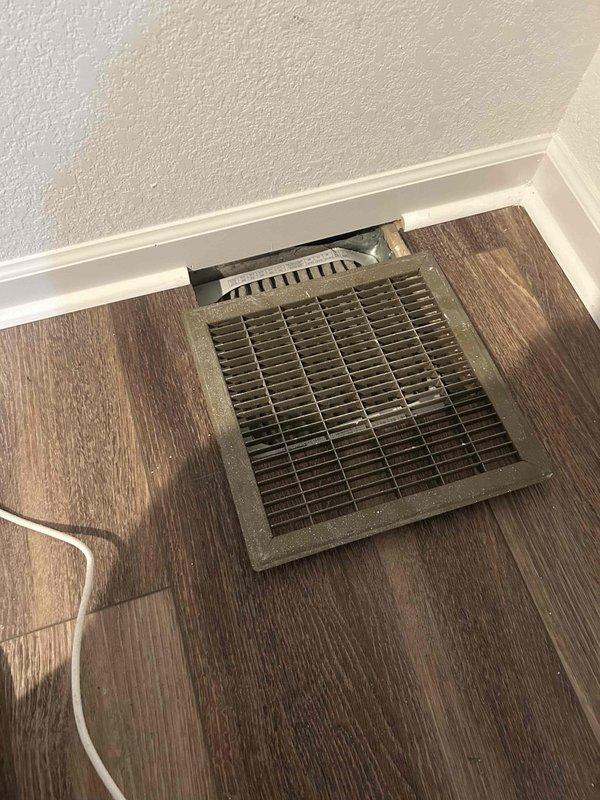 Inspected all supply register boots for proper attachment. Removed floor registers to verify connections. Observed dust accumulation in ductwork; all boots were securely fastened with no detachment issues found.