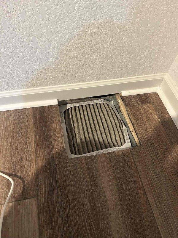 Inspected all supply register boots for proper attachment. Removed floor registers to verify connections. Observed dust accumulation in ductwork; all boots were securely fastened with no detachment issues found.