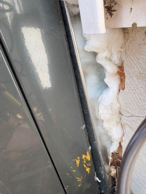 Conducted site assessment for package unit reinstallation. Observed significant issues with existing installation including improper sealing between unit housing and wall (excessive expanding foam application with discoloration indicating possible moisture intrusion). Documentation of current conditions completed with detailed photography to support comprehensive reinstallation quote.