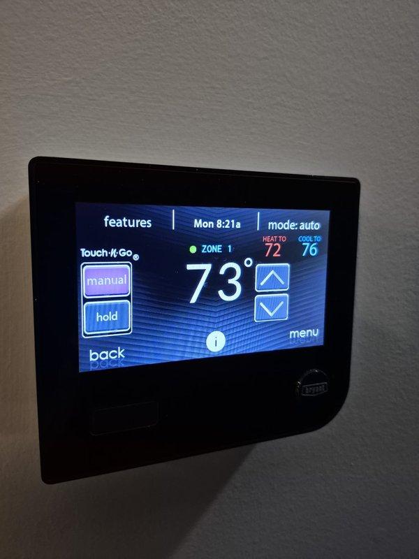 Performed scheduled cooling maintenance visit on Bryant HVAC system. Inspected thermostat functionality, confirming proper operation with heat/cool settings at 72°/76° respectively, and verified outside temperature sensor reading correctly at 72°F. System was operating in auto mode with fan functioning normally.