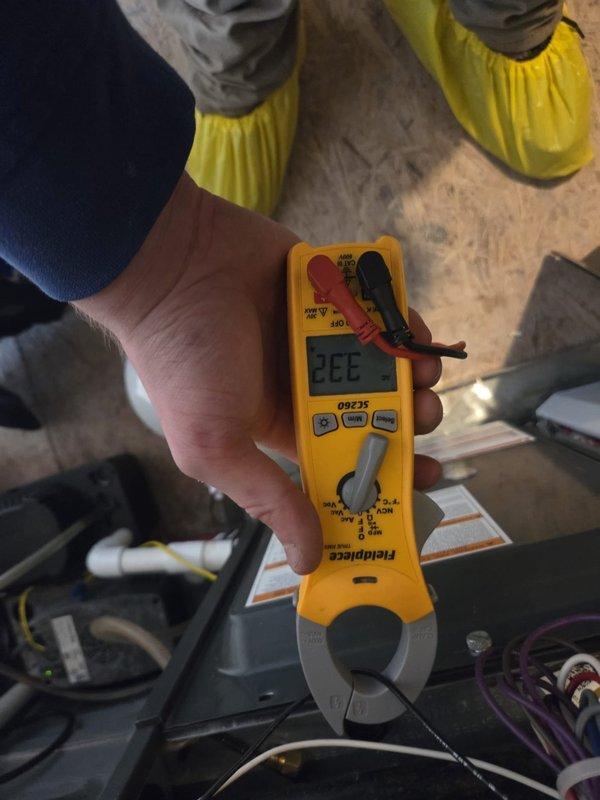 Performed routine maintenance on the heating system, checking thermostat functionality (ecobee operating normally at 70°F with scheduled programming intact). Conducted electrical diagnostics using clamp meter, verifying amperage readings of 333 which fall within manufacturer specifications. System is functioning properly with no issues detected.