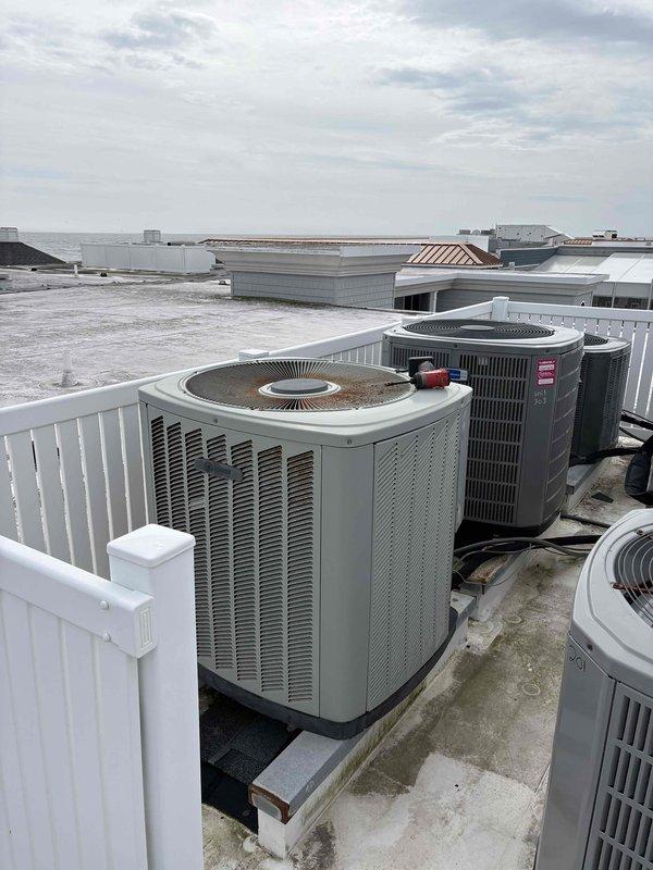 Completed scheduled cooling maintenance on residential HVAC system. Inspected rooftop condensers and verified proper insulation on ductwork, measuring approximately 12-13 inches. All components are functioning within normal parameters.