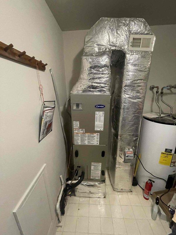 Completed removal and installation of a complete HVAC system, including a Carrier 27SCA536A003 3-Ton 15 SEER Heat Pump, Carrier FJ5ANB36L00 Fan Coil Unit, Carrier FF2601C10 10kW Electric Heat Kit Pack, and Honeywell Digital WiFi Thermostat TH6320WF. Per customer request, unit was mounted on a 2' stand, with existing ductwork adapted using new metal transitions, replacement of outdoor disconnect and electrical whip while reusing existing electrical, condensation and power lines.