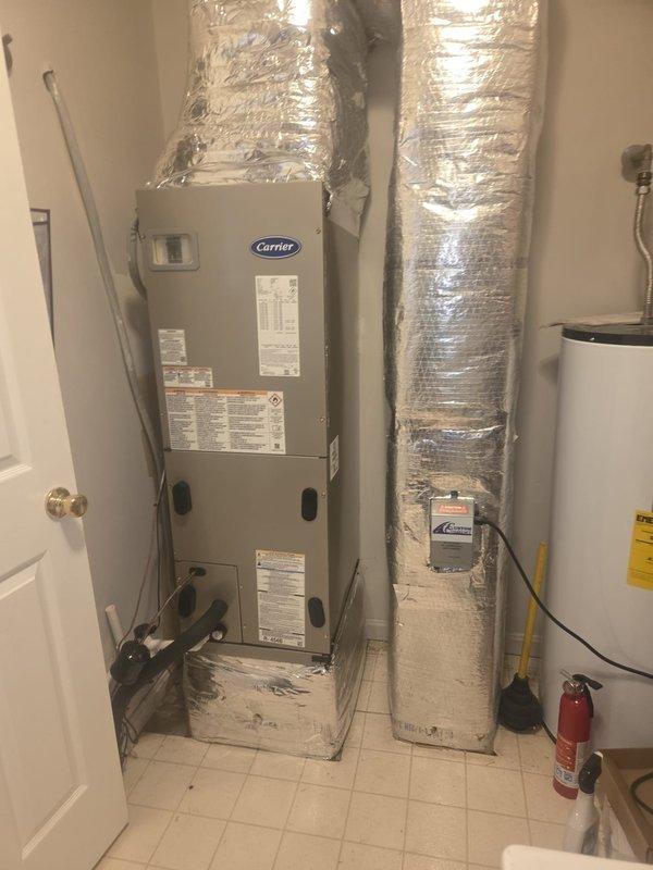 Completed removal and installation of a complete HVAC system, including a Carrier 27SCA536A003 3-Ton 15 SEER Heat Pump, Carrier FJ5ANB36L00 Fan Coil Unit, Carrier FF2601C10 10kW Electric Heat Kit Pack, and Honeywell Digital WiFi Thermostat TH6320WF. Per customer request, unit was mounted on a 2' stand, with existing ductwork adapted using new metal transitions, replacement of outdoor disconnect and electrical whip while reusing existing electrical, condensation and power lines.