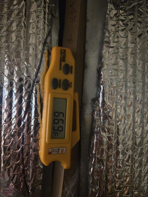 Performed cooling system maintenance service on 2 systems. Conducted temperature differential testing with digital thermometer, recording 65.7°F at supply vents. Inspected ductwork and insulation in attic space, confirming proper installation and sealing of reflective bubble insulation on air distribution components.