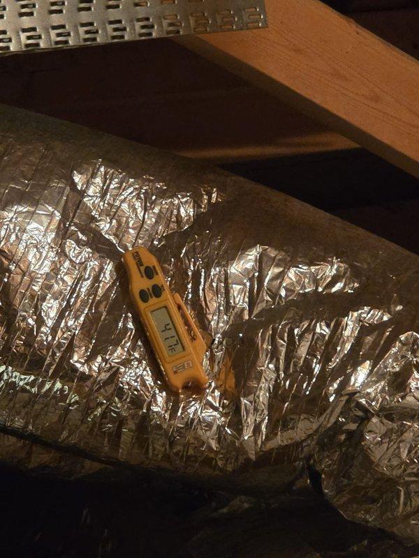 Performed cooling system maintenance service on 2 systems. Conducted temperature differential testing with digital thermometer, recording 65.7°F at supply vents. Inspected ductwork and insulation in attic space, confirming proper installation and sealing of reflective bubble insulation on air distribution components.