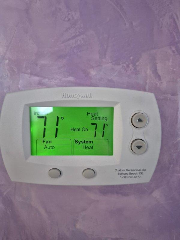 Responded to service call for upstairs HVAC system located in attic that was running continuously despite reaching setpoint temperature. Diagnostic inspection revealed thermostat was correctly displaying 71°F with heat setting at 71°F but system failed to disengage. Performed system reset and recalibrated thermostat control parameters to restore proper cycling operation. Verified proper function through multiple test cycles before returning system to service.
