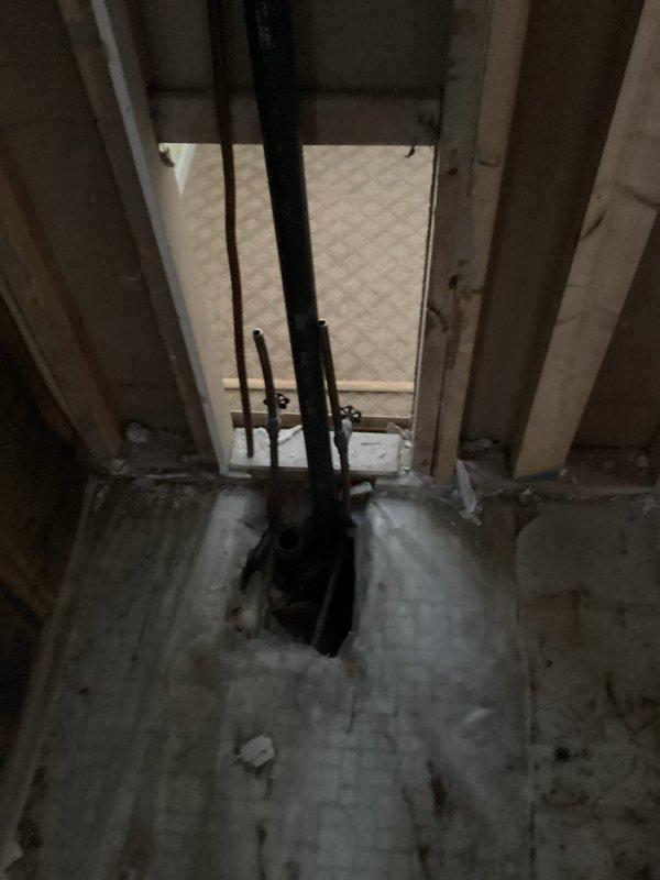 Completed installation of plumbing pipes and fixtures for new construction. Installed waste piping through floor and wall cavities, including proper venting systems. Set all fixtures including tub, toilets, and sinks with appropriate supply lines, compression valves, and drainage components in brushed nickel finish as specified.