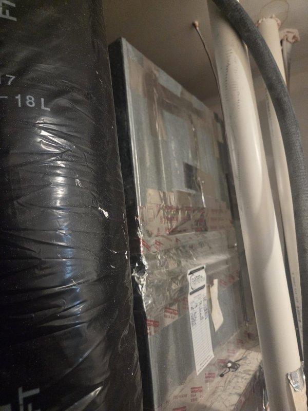 Performed scheduled cooling maintenance service on residential HVAC system. Inspected refrigerant lines and insulation, noting proper installation of line set with appropriate black insulation wrap. Examined electrical connections at junction box and verified system operation within manufacturer specifications.