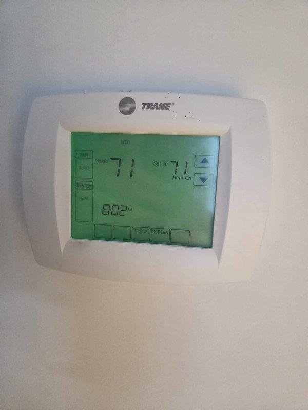 Performed priority maintenance service on two cooling systems. Inspected Trane thermostat functionality (confirmed operational at 71°F setpoint) and conducted electrical diagnostics using clamp meter, which measured 10.6 amps on the HVAC system's control circuitry. All systems operating within normal parameters after service.