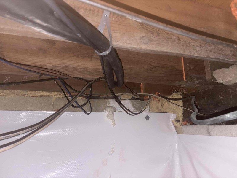 Successfully installed a Mitsubishi mini-split system, including mounting the MUZ-WX12NL heat pump outdoor unit on a wall bracket and installing the MSZ-WX12NL fan coil unit above the sunroom sliding glass door. Completed all necessary refrigeration, condensation, and low voltage line installations through the crawlspace to the outdoor unit, concealed exterior lines in white PVC covering, and installed surge disconnect.