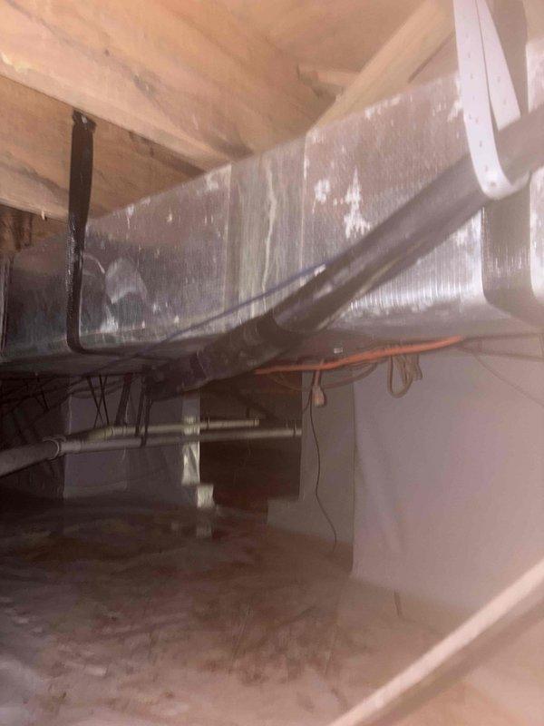 Successfully installed a Mitsubishi mini-split system, including mounting the MUZ-WX12NL heat pump outdoor unit on a wall bracket and installing the MSZ-WX12NL fan coil unit above the sunroom sliding glass door. Completed all necessary refrigeration, condensation, and low voltage line installations through the crawlspace to the outdoor unit, concealed exterior lines in white PVC covering, and installed surge disconnect.