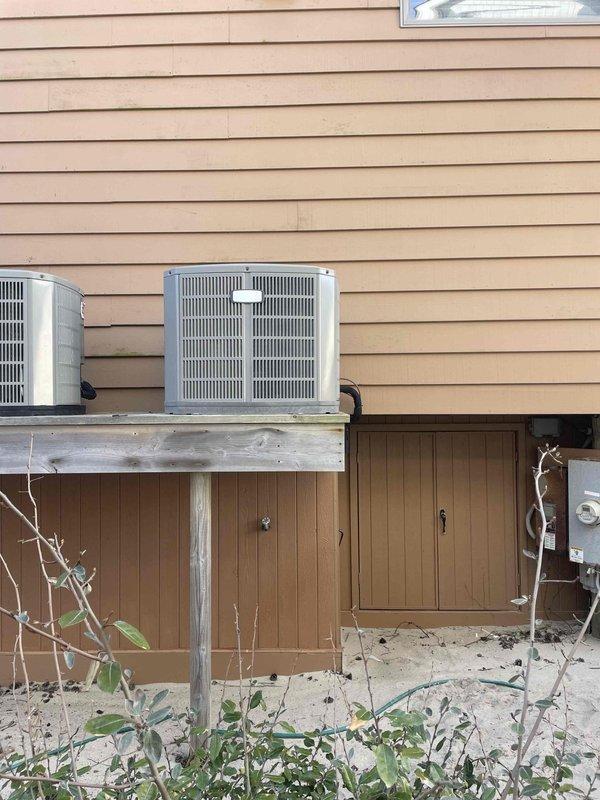 Responded to customer concern regarding continuously running compressor and high electricity bills. Performed diagnostic inspection on three HVAC cooling systems installed on elevated wooden platforms against exterior of residence. Identified and corrected system cycling issue, verified proper operation of all three condensing units, and confirmed normal compressor function. Systems now operating within normal parameters.