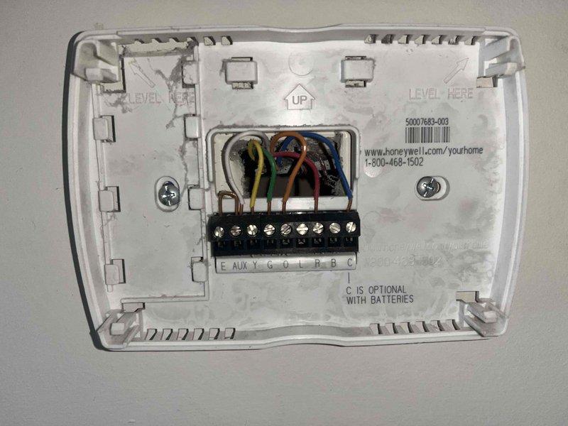 Performed scheduled maintenance on dual HVAC system. Inspected and verified proper operation of Honeywell thermostat, confirming correct wiring configuration at terminal block (Y, G, O, L, R, B, C). System functioning normally with indoor temperature at 73°F; all controls and display working properly.