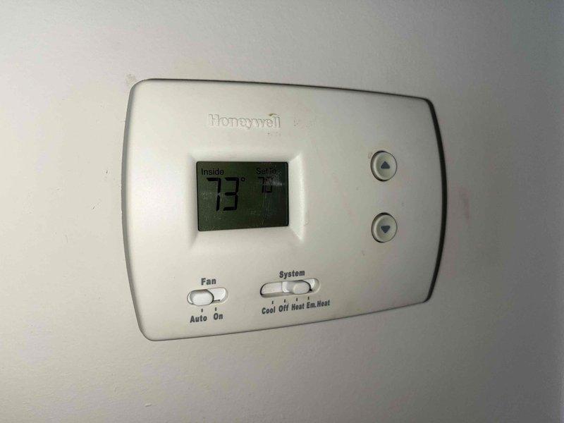 Performed scheduled maintenance on dual HVAC system. Inspected and verified proper operation of Honeywell thermostat, confirming correct wiring configuration at terminal block (Y, G, O, L, R, B, C). System functioning normally with indoor temperature at 73°F; all controls and display working properly.