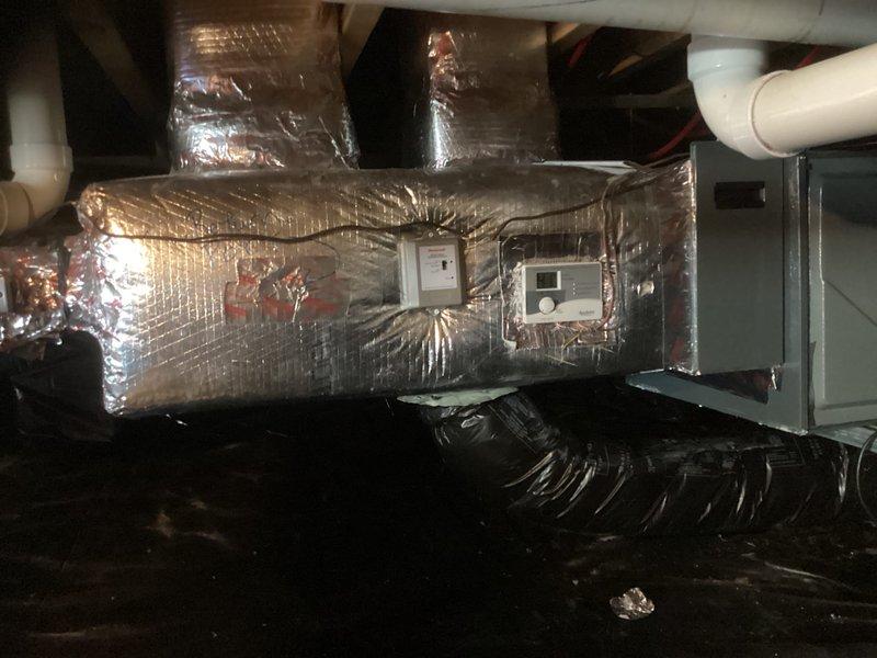 Conducted replacement estimate for 14-year-old HVAC system that is currently operational with no reported issues. Inspected existing air handler with digital control panels and insulated ductwork. Documented system condition with photographs for accurate replacement proposal.