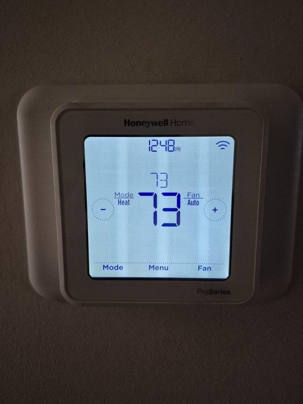 Performed routine cooling maintenance service on two systems. Inspected and verified proper operation of both Honeywell thermostats - one ProSeries digital model (operating at 73°F in heat mode with auto fan) and one standard digital model (operating at 67°F in heat mode with auto fan). All systems functioning within normal parameters.