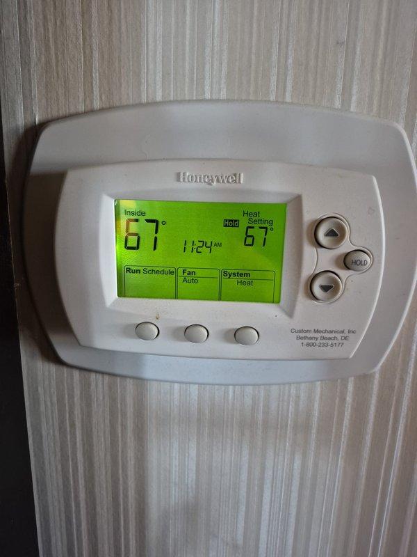 Performed routine cooling maintenance service on two systems. Inspected and verified proper operation of both Honeywell thermostats - one ProSeries digital model (operating at 73°F in heat mode with auto fan) and one standard digital model (operating at 67°F in heat mode with auto fan). All systems functioning within normal parameters.