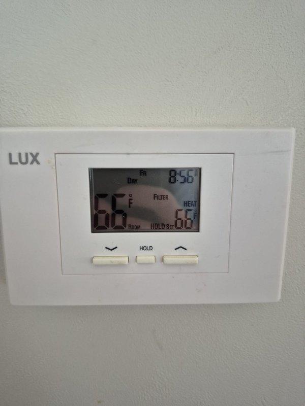 Performed routine cooling system maintenance check on residential HVAC unit for a returning customer. Verified thermostat functionality (LUX digital model) was operating properly in heat mode at 66°F. Conducted electrical diagnostics using clamp meter, confirming amperage draw of 56.9 amps on compressor, which is within acceptable parameters. System is now operating efficiently with no issues detected.