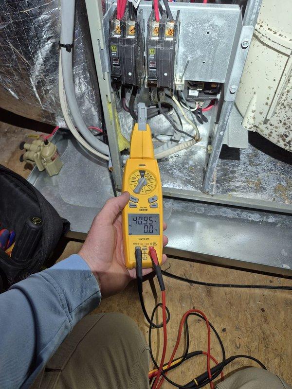 Responded to no-heat call and diagnosed system. Discovered thermostat was functioning properly with room temperature at 72°F despite customer-reported heating issue. Electrical testing of the circuit breaker panel confirmed proper voltage to the system at 40.95V. After inspection, determined the heating system was operational with no defects; customer may have experienced temporary power interruption during recent storm which reset the system.