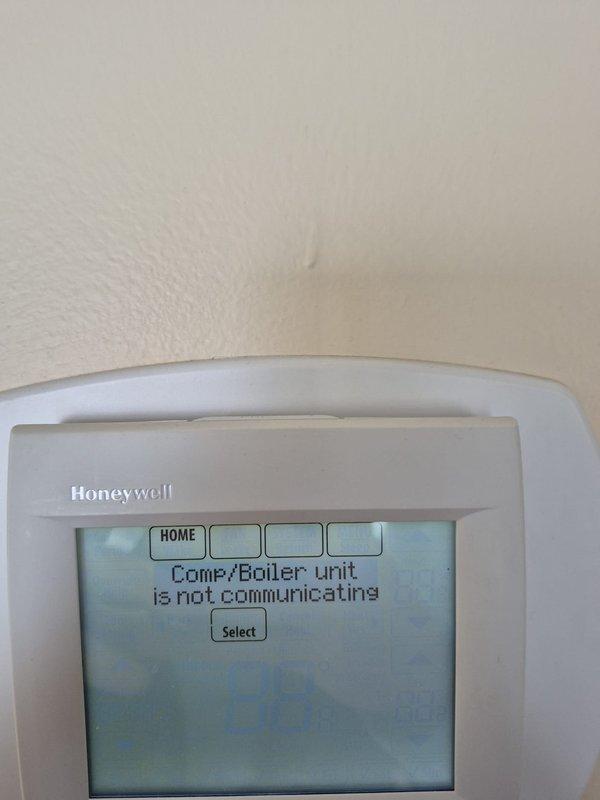# Service Summary

Responded to no heat call for system with Honeywell RedLink equipment experiencing communication failure. Upon arrival, found thermostat displaying "Comf/Boiler unit is not communicating" error message, indicating loss of wireless connection between RedLink gateway and heating equipment. Inspected rooftop HVAC units and verified all equipment powered on with no visible mechanical issues. Troubleshot RedLink wireless communication system by checking signal strength, gateway status, and thermostat pairing. Reset communication between thermostat and boiler control module by power cycling equipment and re-establishing wireless link. Verified thermostat successfully reconnected to heating system and cleared error message. Tested system operation through full heating cycle to confirm proper communication and temperature control restored. System now functioning normally with stable wireless connection between all RedLink components.