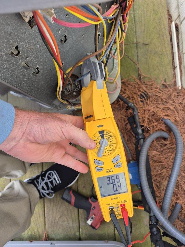 # HVAC Service - Tune-Up Summary

Completed scheduled system tune-up and reinspection on two HVAC systems after rescheduling to afternoon due to street access issues. Performed diagnostic testing including voltage verification at 24V control circuit using digital multimeter, confirmed proper thermostat operation with system holding at 68°F heat setting, and verified all electrical connections at outdoor unit wiring harness. All systems tested and operating within normal parameters with no deficiencies noted.