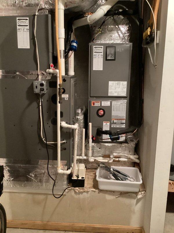 Completed preventive maintenance cooling visit on residential HVAC system. Inspected air handler unit, ductwork, and associated plumbing connections in utility room. Verified ecobee smart thermostat operation and system performance, with unit holding at setpoint temperature. All equipment found operating within normal parameters.