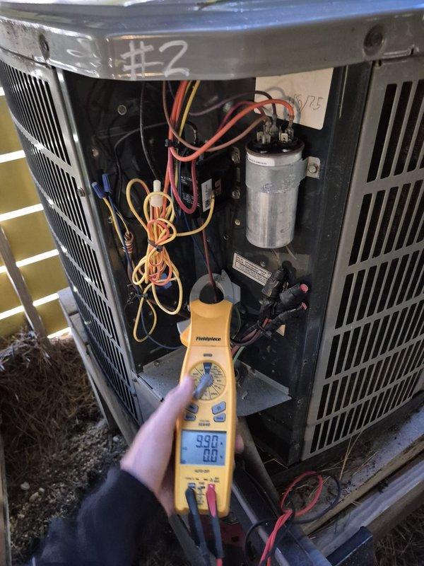Performed preventive maintenance on outdoor condensing unit #2 as part of a two-system cooling maintenance service. Conducted electrical diagnostics using digital multimeter to verify system performance, measuring voltage and amperage at key components. Inspected and tested dual-run capacitor, contactor, and associated electrical connections. Verified proper wiring connections and terminal integrity throughout the control circuit. All electrical components tested within normal operating parameters. Unit operational and ready for cooling season.