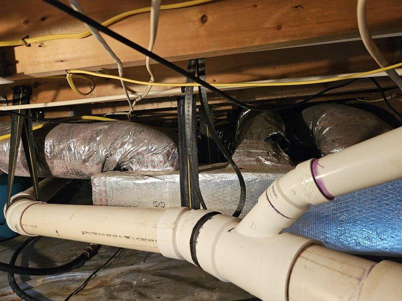 Conducted comprehensive assessment of existing ductwork system in crawl space following resolution of rodent infestation. Inspected flexible ductwork runs, insulation wrapping integrity, and support structures throughout underfloor area. Provided detailed estimate for complete ductwork replacement to restore proper HVAC system performance and ensure code-compliant installation with adequate support and sealed connections.