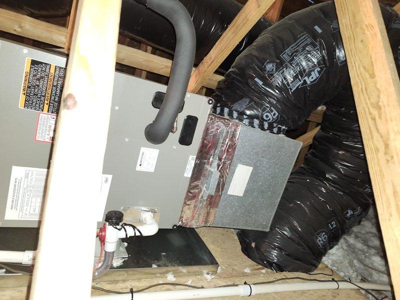 Completed full HVAC system replacement including removal and disposal of existing equipment. Installed Lennox ML14KP1-018 1.5-ton 14 SEER heat pump on pressure-treated wood platform with new outdoor disconnect and electrical whip. Mounted Lennox CBK45UHET-024 air handler in attic space with 10kW electric heat pack. Fabricated and installed metal duct transitions to adapt new equipment to existing ductwork. Reused existing condensate drain lines and refrigerant line sets where applicable. Replaced deteriorated armaflex insulation on refrigerant lines. Installed Honeywell TH6320WF digital WiFi thermostat for system control. Verified all electrical connections, tested system operation, and confirmed proper airflow throughout. System commissioned and left in full working order.