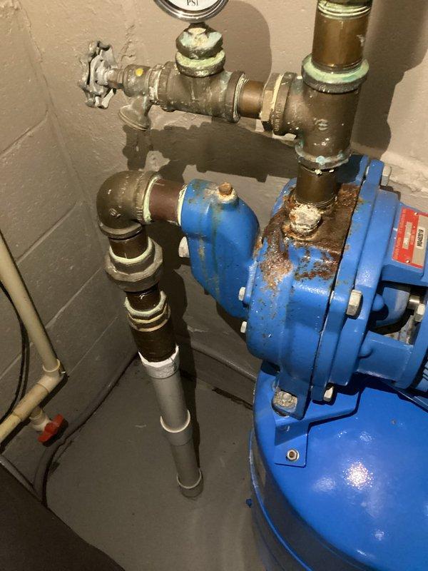 Completed warranty replacement installation of Rheem tanked water heater. Removed existing failed unit and installed new tank with proper water supply connections, pressure relief valve, and electrical wiring to terminal block. Verified all plumbing connections for proper sealing, tested pressure gauge readings, and confirmed electrical connections with appropriate wire terminations. System tested and operational upon completion.