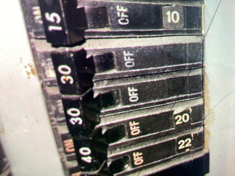 Conducted on-site assessment of existing 40-gallon medium electric tank water heater in summer rental property experiencing inadequate hot water capacity. Evaluated current electrical service at breaker panel and documented existing water heater installation including copper supply piping and brass fittings in utility closet. Prepared estimate for conversion from electric tank water heater to propane-fired tankless system to improve hot water availability and accommodate seasonal rental demands prior to peak occupancy period.