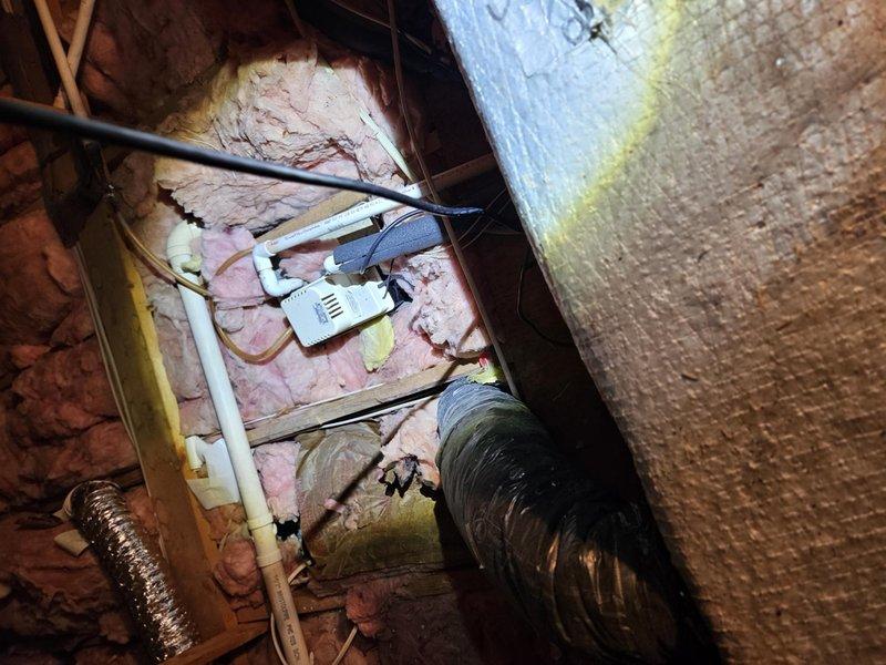 Completed comprehensive residential ductwork assessment in attic space, documenting existing HVAC distribution system including flexible ductwork routing, insulated supply lines, and structural clearances. Evaluated current duct configuration, insulation conditions, and identified areas requiring modification or replacement to optimize airflow efficiency and system performance.