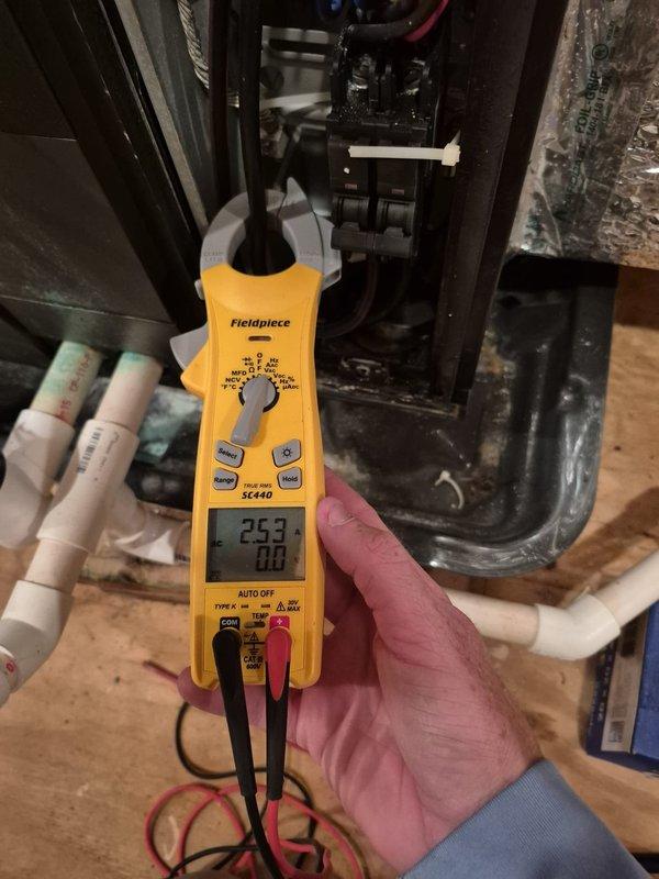 Performed preventive maintenance on dual HVAC cooling systems. Conducted electrical diagnostics using digital multimeter to verify system amperage and voltage readings, confirmed proper capacitor operation, and tested thermostat functionality showing system in heating mode at setpoint with all controls responding appropriately.