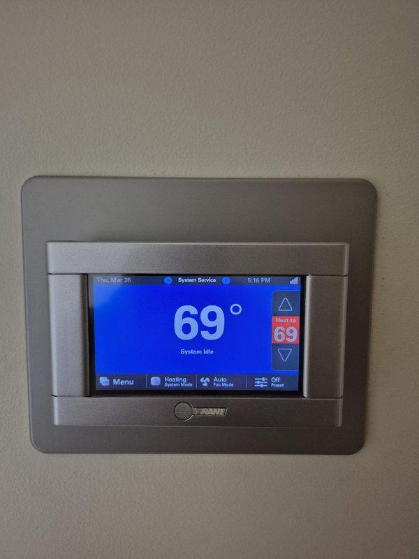 Performed preventive maintenance on dual HVAC cooling systems. Conducted electrical diagnostics using digital multimeter to verify system amperage and voltage readings, confirmed proper capacitor operation, and tested thermostat functionality showing system in heating mode at setpoint with all controls responding appropriately.