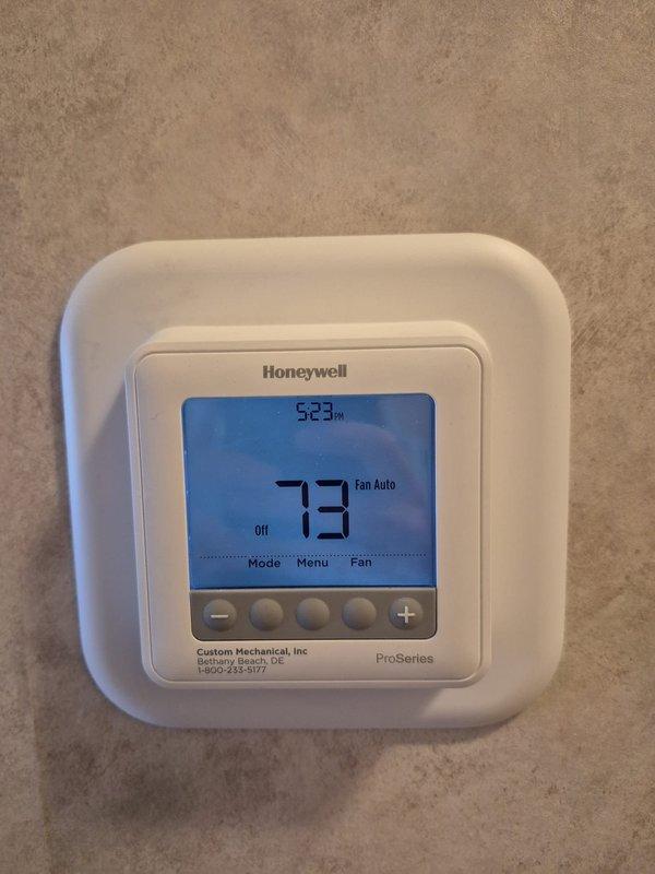 # HVAC Service Report

Responded to emergency no-heat call for elderly customer. Upon arrival, found Honeywell ProSeries thermostat displaying 73°F with system in "Off" mode and fan set to "Auto." Proceeded to outdoor unit to diagnose heating system failure. Performed electrical diagnostics using clamp meter, measuring current draw and testing relay/contactor operation. Identified faulty relay component preventing heating system from engaging. Replaced defective relay, verified proper electrical readings showing 2.1 amp draw, and restored heat to residence. System tested and confirmed operational before departure.