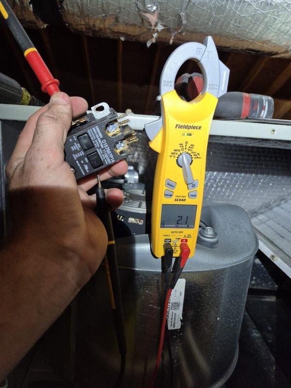 # HVAC Service Report

Responded to emergency no-heat call for elderly customer. Upon arrival, found Honeywell ProSeries thermostat displaying 73°F with system in "Off" mode and fan set to "Auto." Proceeded to outdoor unit to diagnose heating system failure. Performed electrical diagnostics using clamp meter, measuring current draw and testing relay/contactor operation. Identified faulty relay component preventing heating system from engaging. Replaced defective relay, verified proper electrical readings showing 2.1 amp draw, and restored heat to residence. System tested and confirmed operational before departure.