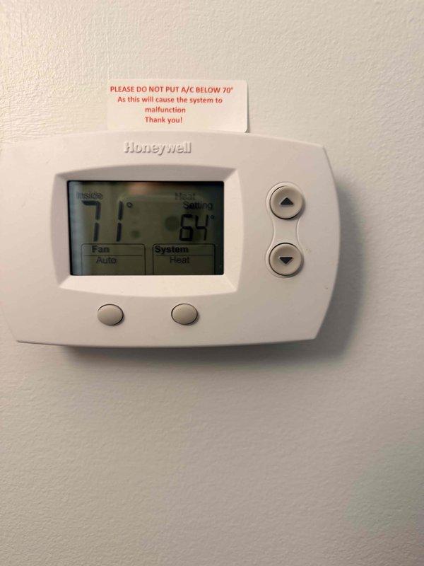 Conducted on-site assessment for dual fuel system replacement serving multi-floor residential property. Evaluated existing equipment including two heat pumps and two air handlers located in outside mechanical room on first floor and second-floor laundry room, with systems serving second and third-floor rental units. Documented current equipment specifications and configurations through photographic documentation of air handler unit in attic space and existing Honeywell thermostat control. Prepared comprehensive estimate for complete dual fuel system replacement to address heating and cooling needs for multiple zones.