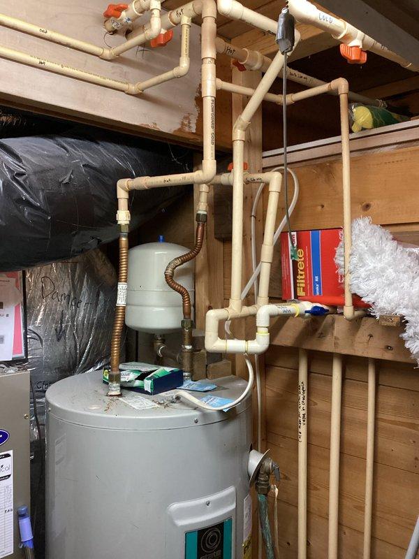 Completed de-winterization service for residential property. Restored electrical power and heating system, set thermostat to 50 degrees, and activated refrigerator. Inspected water heater, plumbing distribution system with multiple zone valves, and verified all connections were secure and operational for seasonal occupancy.