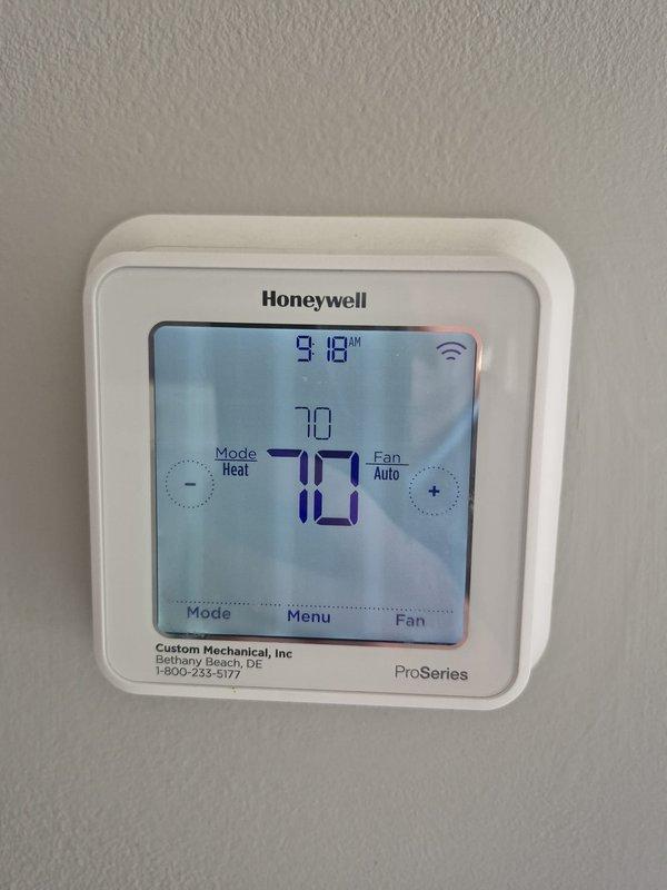 Performed preventative maintenance and leak check on two HVAC systems. Downstairs unit was found to be low on refrigerant; added two pounds of refrigerant and injected UV dye into the system to facilitate leak detection during next scheduled maintenance visit. Both thermostats verified operational with proper temperature control and settings confirmed.