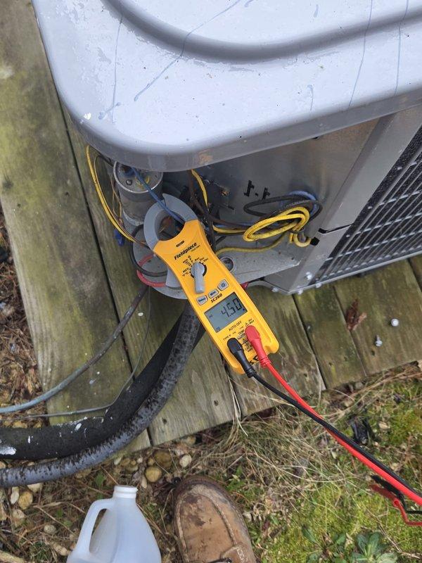 # HVAC Cooling System Maintenance Visit

Performed comprehensive cooling system maintenance on residential air conditioning unit. Conducted electrical diagnostics on outdoor condenser unit, utilizing digital multimeter to test capacitor, contactor, and associated electrical components. Verified proper voltage and amperage readings across system components to ensure optimal operation and identify potential failure points.

Inspected attic-mounted air handler and ductwork infrastructure. Monitored humidity levels in conditioned space using digital hygrometer, recording reading of 21.3% to assess system dehumidification performance. Examined insulated supply ductwork and reflective barrier insulation for proper installation and energy efficiency. Verified refrigerant line insulation integrity at penetration points.

Outdoor unit showed normal wear consistent with age and environmental exposure. All electrical connections tested within manufacturer specifications. System operating efficien