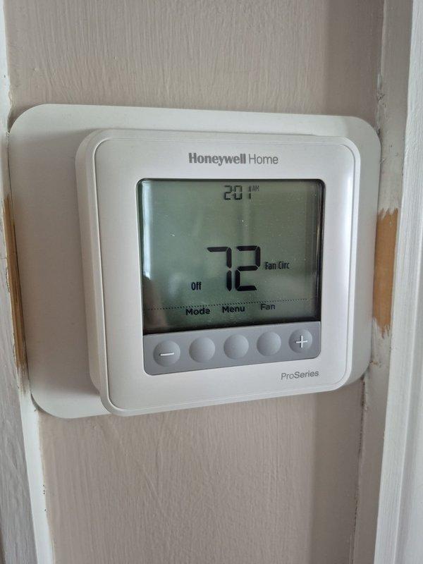 Performed cooling season preventive maintenance inspection on first of two HVAC systems. Verified thermostat operation and confirmed proper temperature display and control settings. System operating within normal parameters with no deficiencies noted at time of service.