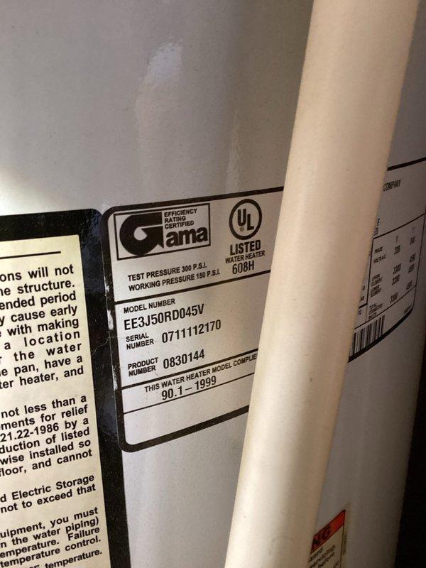 Responded to no hot water complaint for 50-gallon electric water heater located in closet behind kitchen serving front half of residence. Upon inspection, confirmed unit was inoperative with no indicator light illuminated. Identified water heater as AO Smith model EE3J50RD045V manufactured in 1999, which had reached end of serviceable life after 27 years of operation. Documented existing installation conditions including copper supply piping connections and electrical configuration. Provided estimate for replacement of failed electric water heater unit with new equipment to restore hot water service to kitchen and front portion of home.