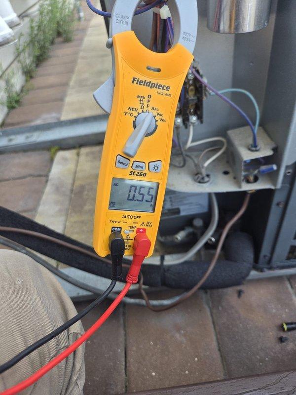 Completed routine cooling maintenance visit on HVAC system. Performed electrical diagnostics using clamp meter, recording amperage readings of 0.55A and 14.1A at various points in the system to verify proper compressor and fan motor operation. All electrical components tested within normal operating parameters, and system confirmed to be functioning correctly for the cooling season.