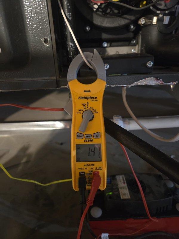 Completed routine cooling maintenance visit on HVAC system. Performed electrical diagnostics using clamp meter, recording amperage readings of 0.55A and 14.1A at various points in the system to verify proper compressor and fan motor operation. All electrical components tested within normal operating parameters, and system confirmed to be functioning correctly for the cooling season.