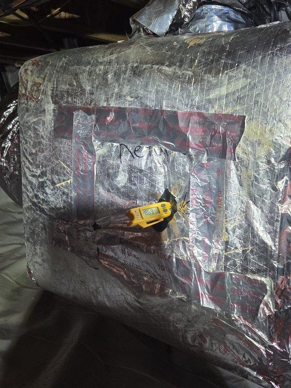 Completed routine cooling maintenance visit on HVAC system. Performed diagnostic testing of ductwork and air handler unit using digital measuring instruments, recording system readings of 482.2. Inspected insulated ductwork and air handler components in attic space, checking for proper operation and any potential issues. All measurements and system parameters were within acceptable ranges for continued operation.