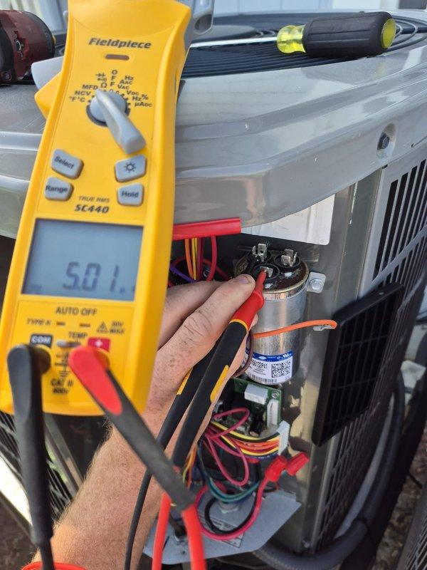 Performed seasonal cooling system maintenance and diagnostics on outdoor condensing unit. Used digital multimeter to measure electrical parameters, recording capacitor readings and verifying proper voltage and amperage levels across system components. All electrical connections inspected and tested, system operating within normal specifications upon completion.